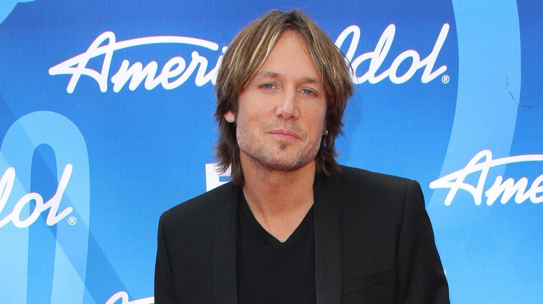 Keith Urban looks on 