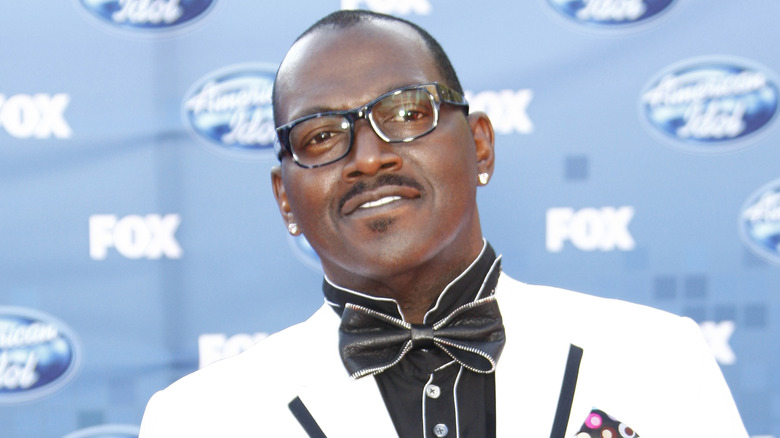 Randy Jackson smiling on the red carpet