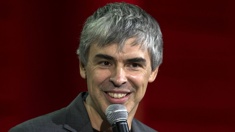 Larry Page holding a microphone