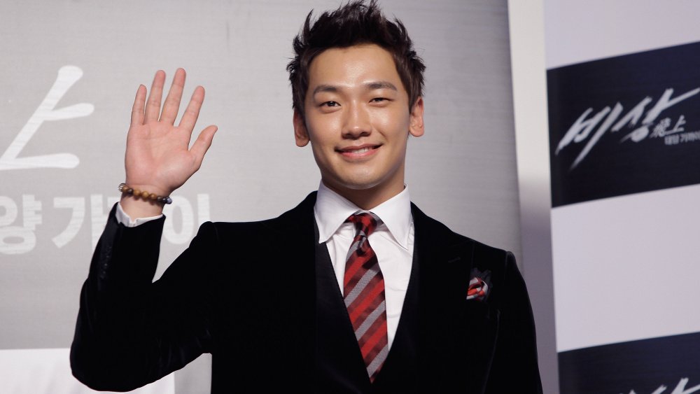 Rain waving and smiling