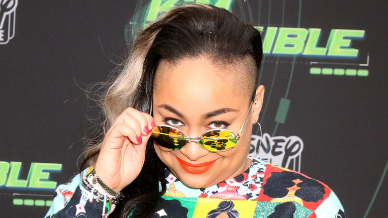 Raven-Symone peering over shades