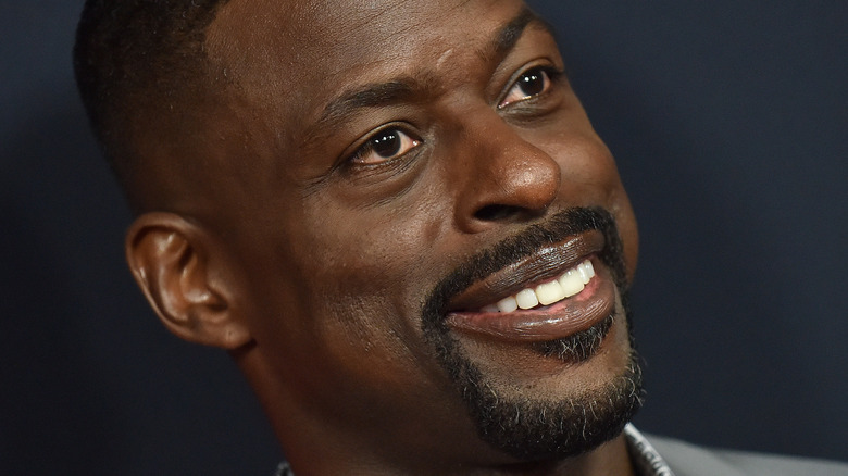 Sterling K. Brown, head tilted, wide smile