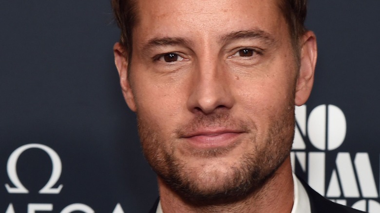 Justin Hartley, slight smile, mouth closed