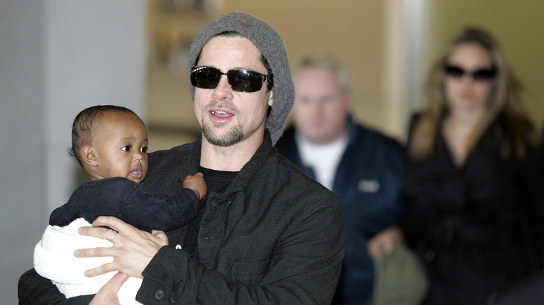 Brad Pitt holding infant daughter Zahara