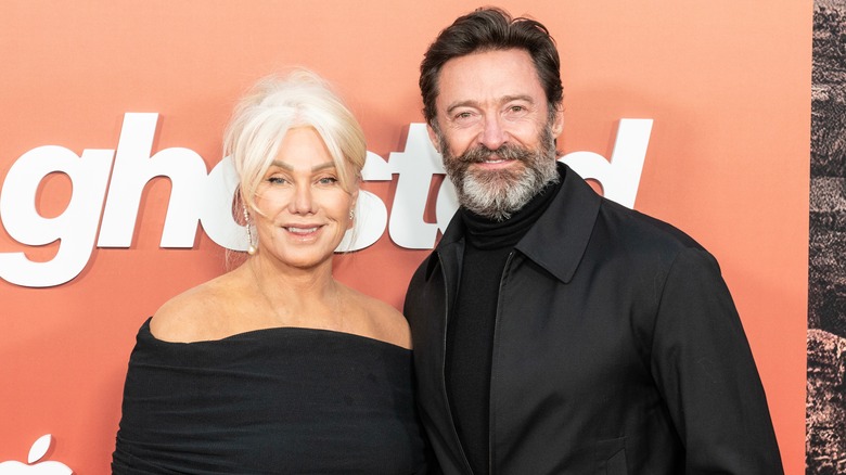 Hugh Jackman and Deborra-Lee Furness wearing black on a red carpet