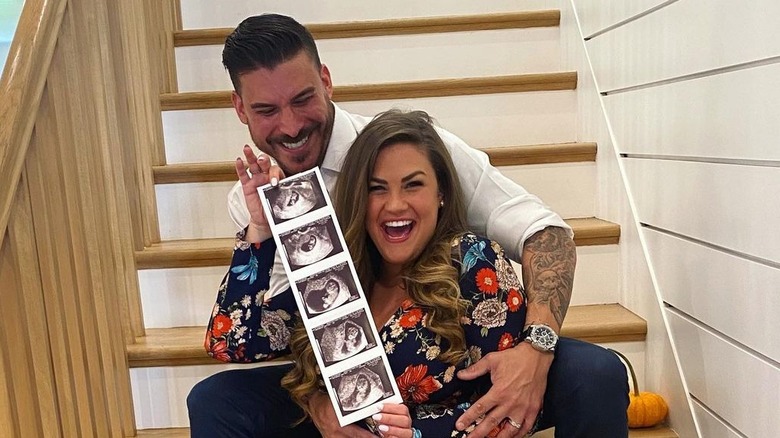 Brittany Cartwright and Jax Taylor pose with their baby's ultrasound photos