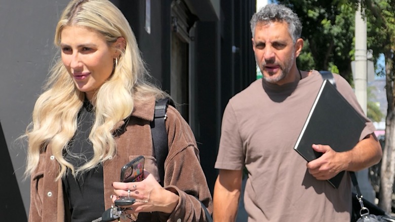 Mauricio Umansky and Emma Slater walking into rehearsal