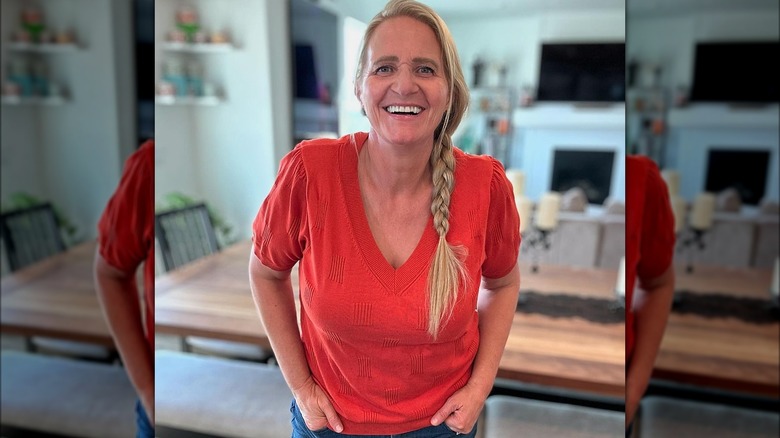 Christine laughing in orange top