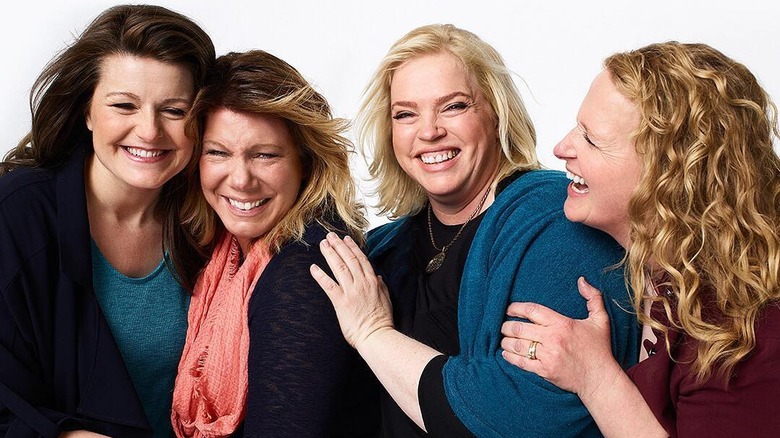 Robyn and her sister wives smiling together