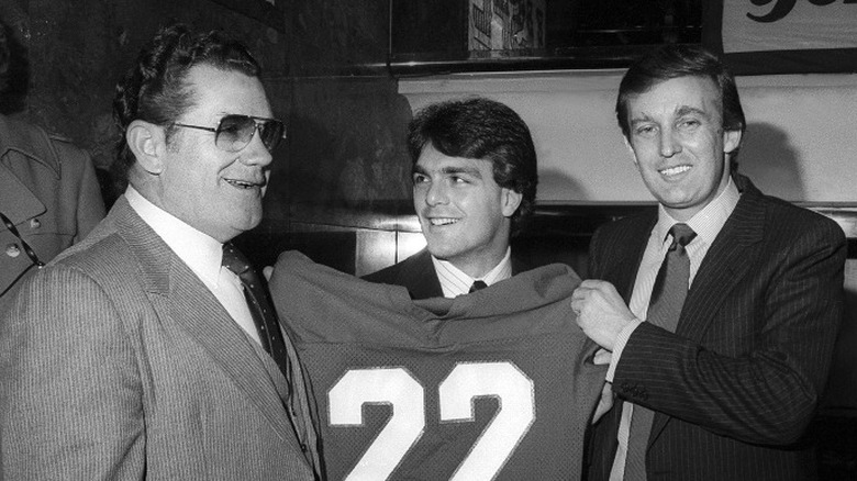 Generals head coach Walt Michaels, quarterback Doug Flutie, and Donald Trump at a USFL press conference (1985)