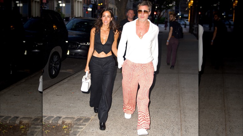 Ines de Ramon walking with brad Pitt