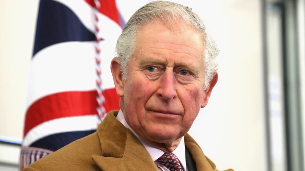 Prince Charles wearing a tan suit