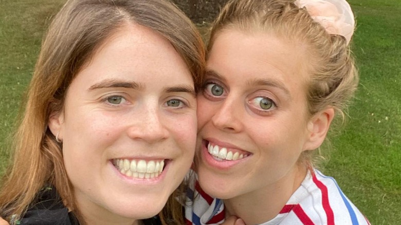 Princess Beatrice Princess Eugenie grinning