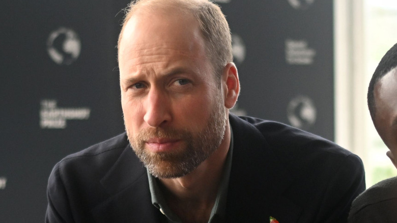 Close up of Prince William looking somber