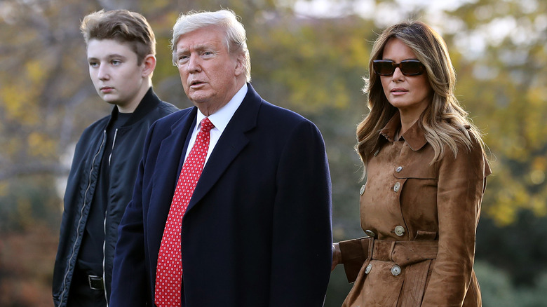 Barron Trump, Donald Trump and Melania Trump walking 