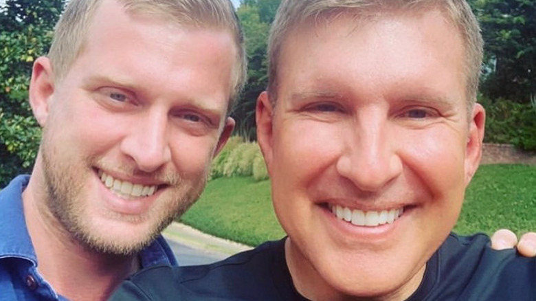 Kyle Chrisley poses with Todd Chrisley