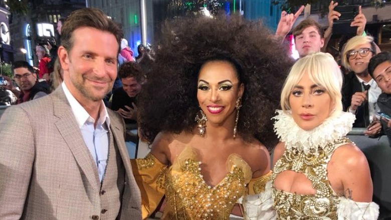 Shangela posing with Bradley Cooper and Lady Gaga