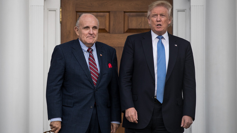 Donald Trump and Rudy Giuliani standing side-by-side at the White House