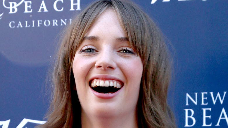 Maya Hawke laughing brown bob hair