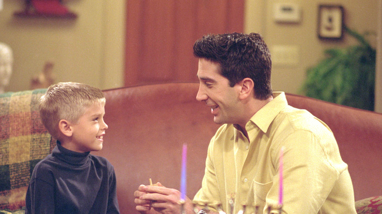 Cole Sprouse and David Schwimmer in a  scene from Friends