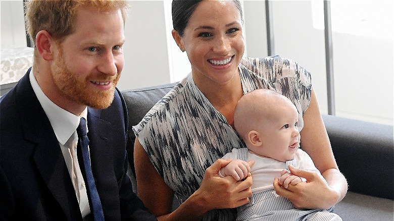 Prince Harry, Meghan Markle, and baby Archie smiling