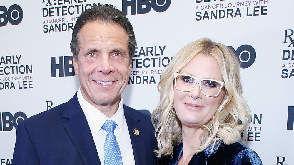 Andrew Cuomo and Sandra Lee posing next to each other