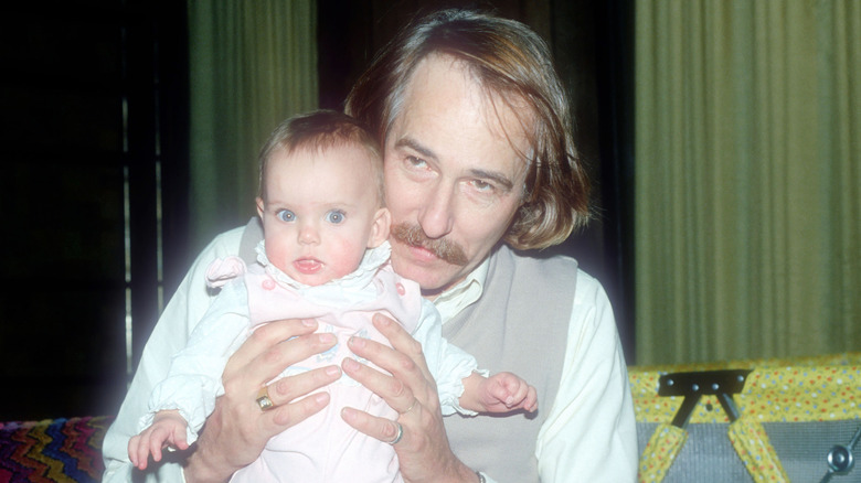 John Phillips holding baby Bijou Phillips