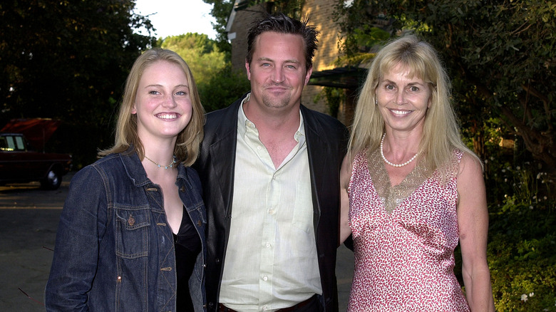 Matthew Perry posing with family