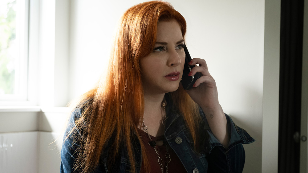 Diane Neal talking on the phone as Peggy Sue Thomas