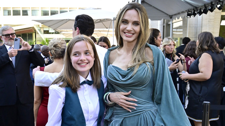 Vivienne and Angelina Jolie opsing together at the Tonys.