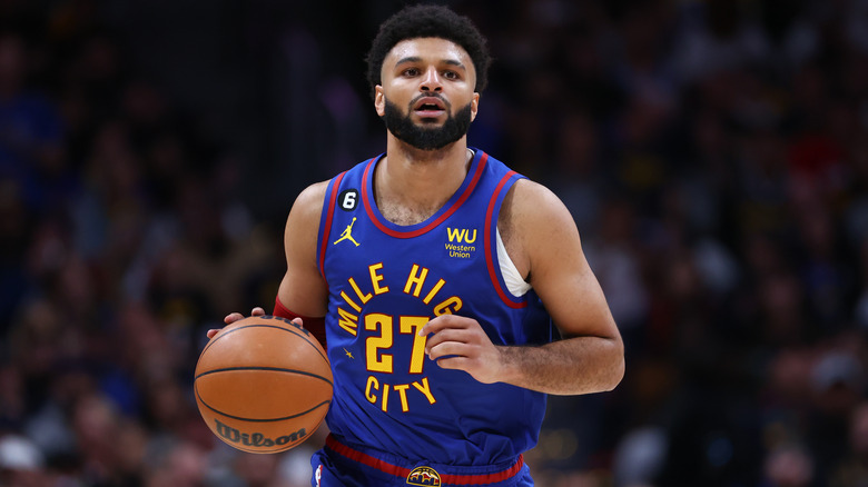 Jamal Murray holding a basketball 