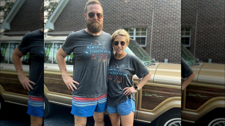 Ben and Erin Napier standing in front of station wagon