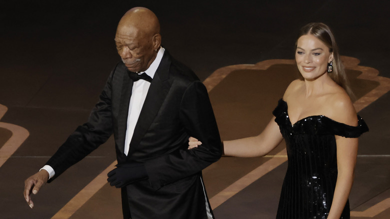 Morgan Freeman walking with Margot Robbie