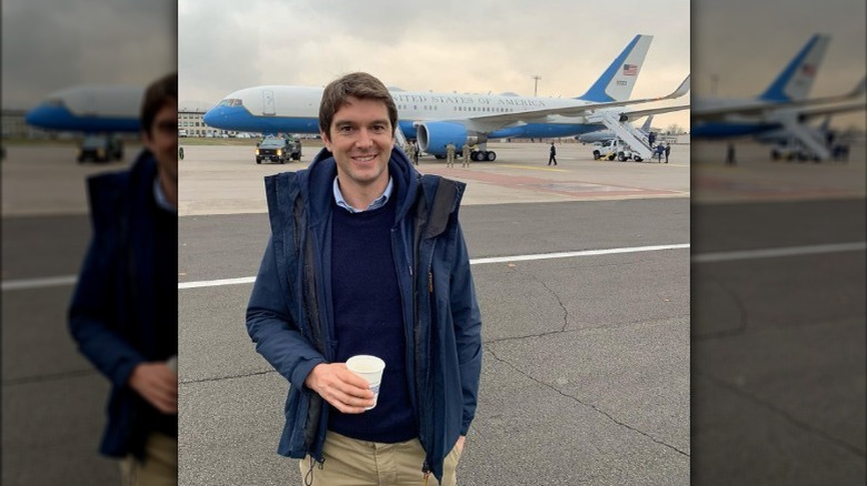 Benjamin Hall pictured in front a plane 