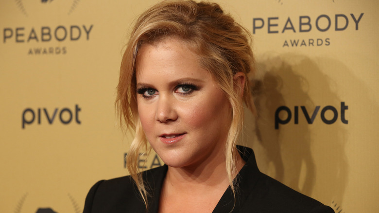 Amy Schumer wearing black jacket