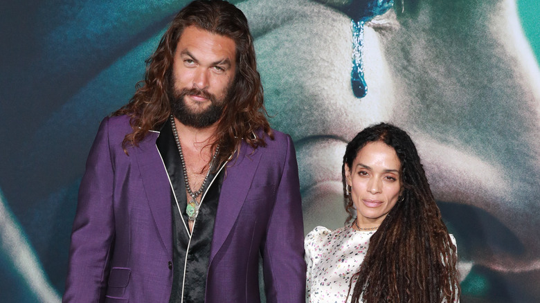 Jason Momoa and Lisa Bonet posing