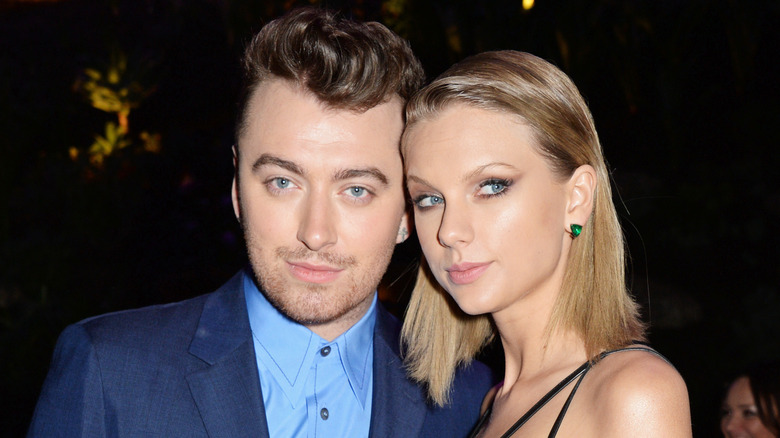 Sam Smith and Taylor Swift pose 