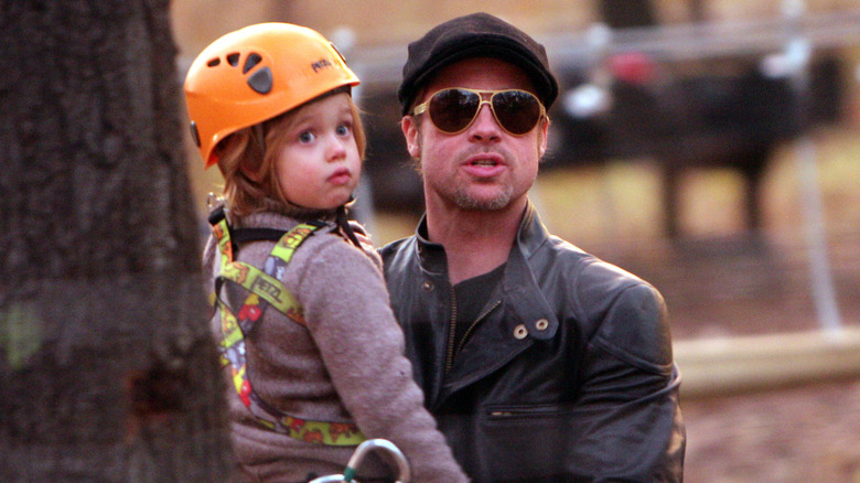 Brad Pitt holding Shiloh Jolie-Pitt