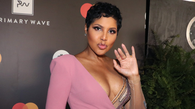 Toni Braxton pink jumpsuit