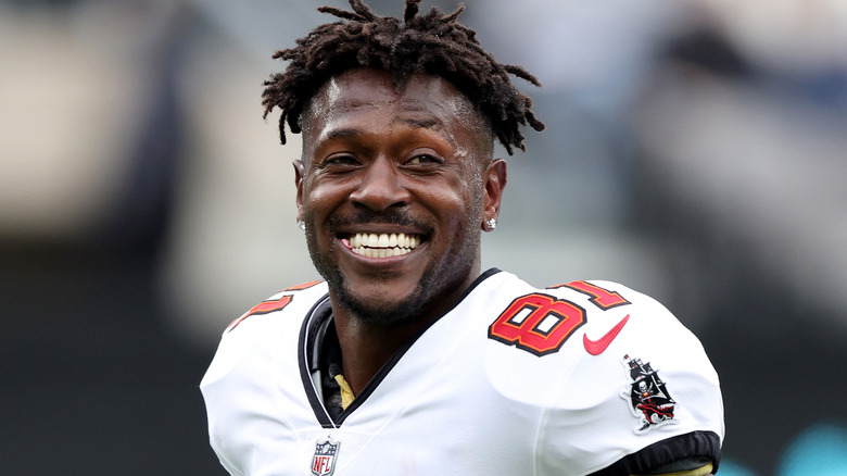 Antonio Brown smiling on field in Tampa uniform