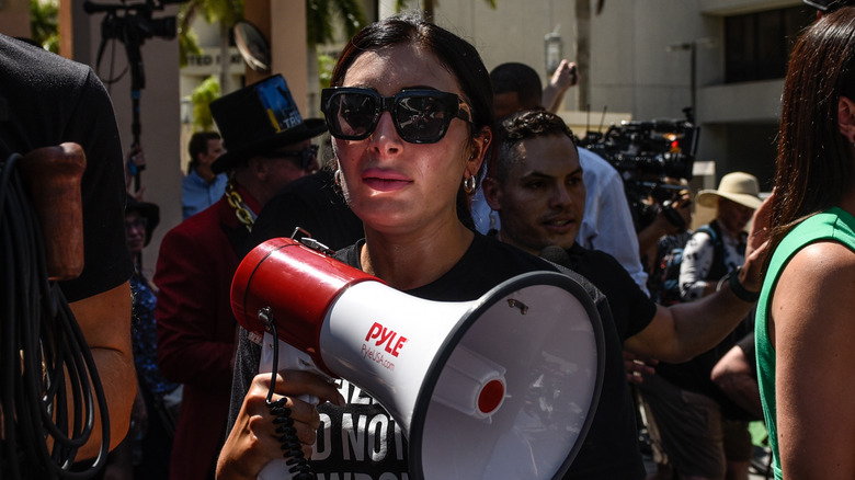 Laura Loomer holding a megaphone