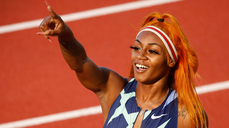 Sha'Carri Richardson, pointing, smiling, 2021 photo on the track