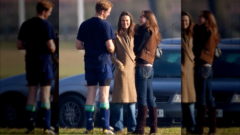 Prince William talking with Kate Middleton and her sister Pippa Middleton after playing in a field game