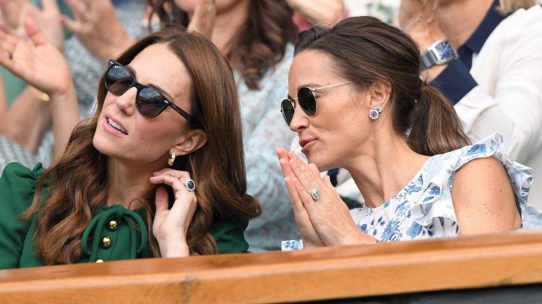 Kate Middleton and Pippa Middleton sitting in the Royal Box on Centre Court during day twelve of the Wimbledon Tennis Championships