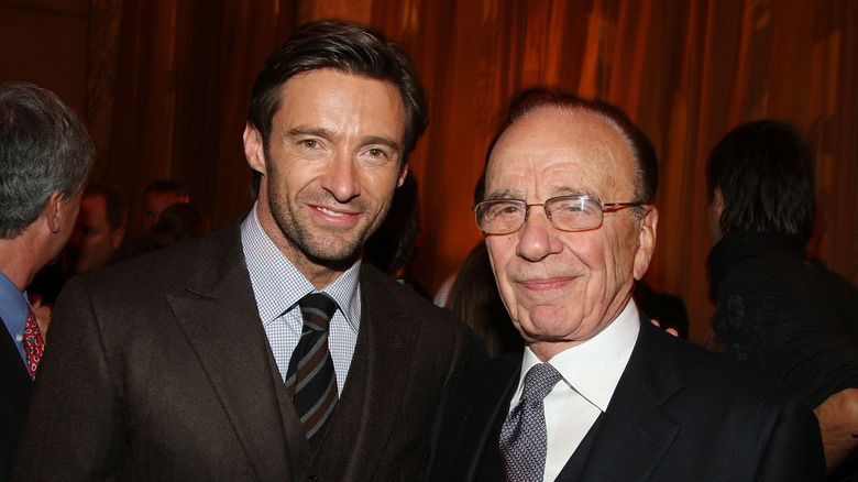 Hugh Jackman and Rupert Murdoch posing together in suits