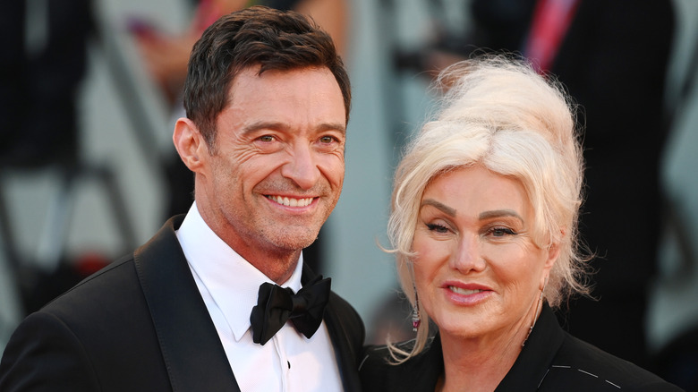 Hugh Jackman alongside Deborra-Lee Furness, both smiling