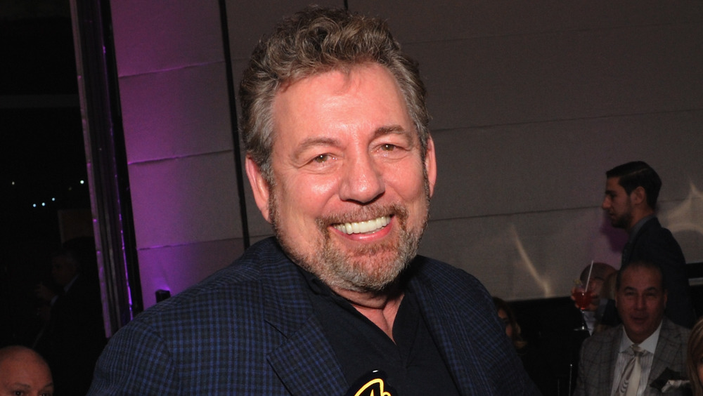 James Dolan smiling for an award