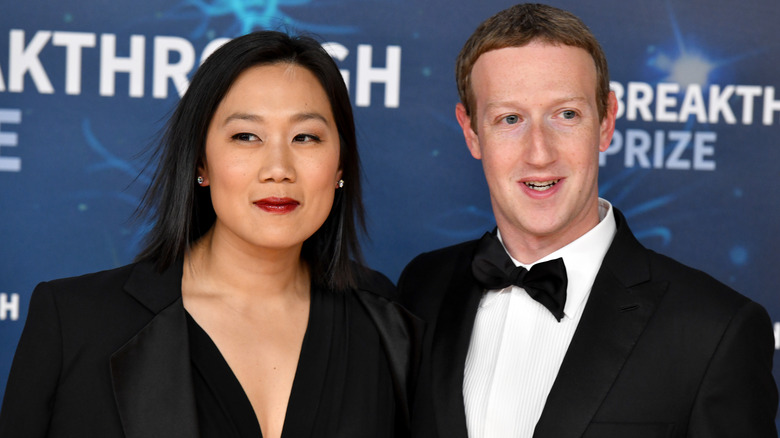 Priscilla Chan and Mark Zuckerberg posing