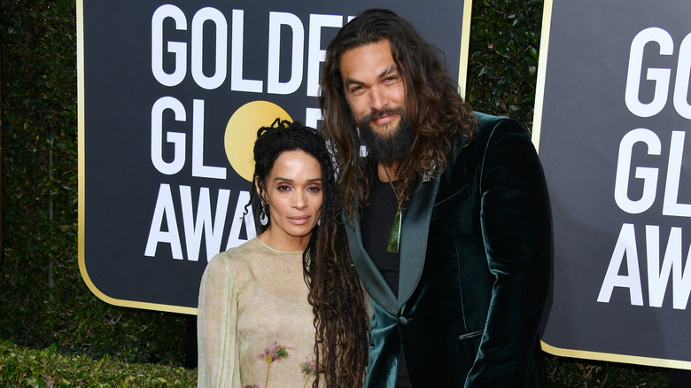 Jason Momoa and Lisa Bonet posing