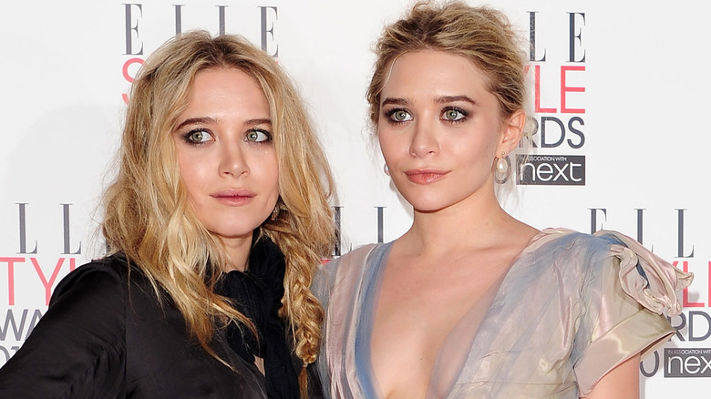 Mary-Kate and Ashley Olsen smiling